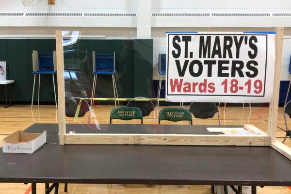 One of the tables, fitted with protective plexiglass, at the sole polling location for city of Waukesha, Wis., residents on April 6, 2020. (Scott Trindl via AP)