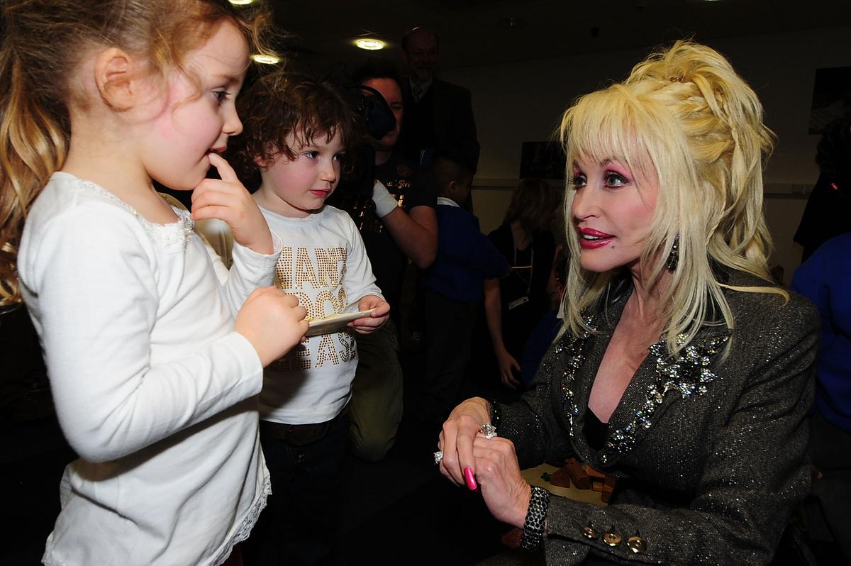 Parton meets young children at the Magna Science and Adventure Park in the town of Rotherham in South Yorkshire, England, on Dec. 5, 2007. (Pool/Getty Images)