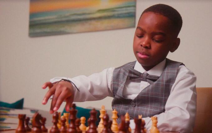 Nine-year-old Tani Adewumi had only been playing chess for one year when he won the New York State Chess Championship, in his age group, last year. (Courtesy of HarperCollins)