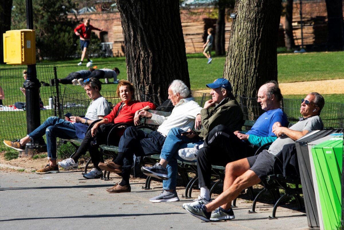 People try to keep a social distance while they enjoy a sunny day at Central Park, as the outbreak of the CCP virus continues, in the Manhattan borough of New York City on April 6, 2020. (Eduardo Munoz/Reuters)