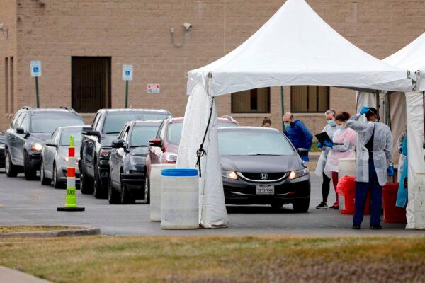 People are tested for COVID-19 at a mobile testing center in Dearborn, Mich., on March 26, 2020. (Jeff Kowalsky/AFP/Getty Images)