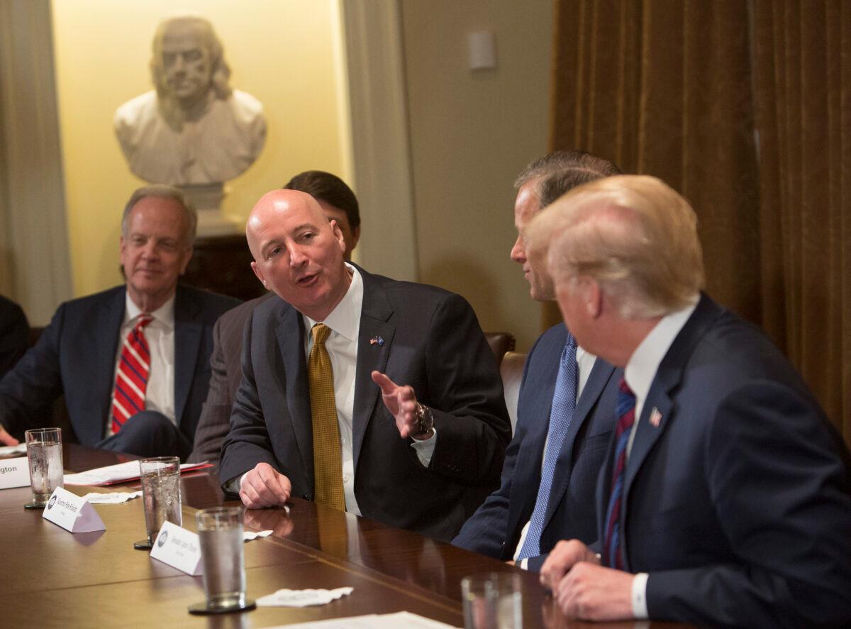 Nebraska Gov. Pete Ricketts speaks to President Donald Trump during a meeting on trade with governors and members of Congress at the White House in Washington on April 12, 2018. (Chris Kleponis - Pool/Getty Images)