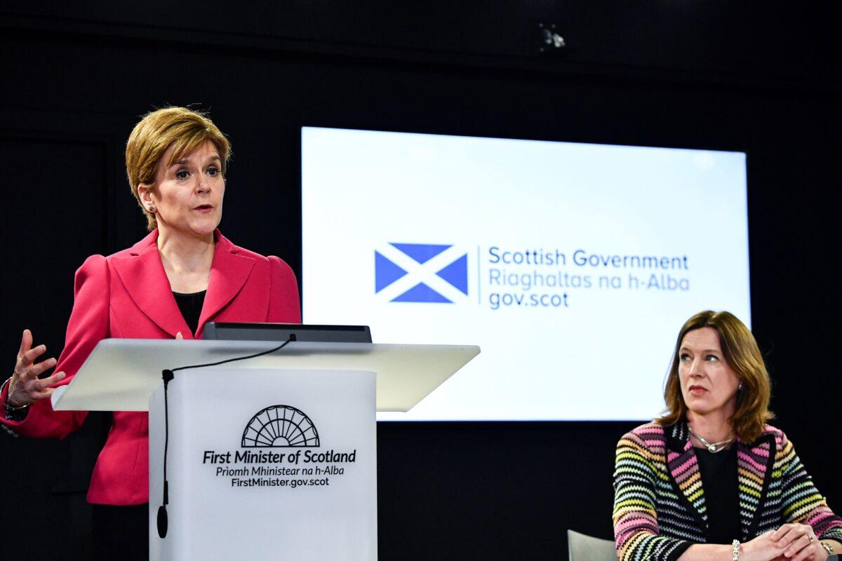 Scotland's First Minister Nicola Sturgeon, left, speaks as Chief Medical Officer Dr. Catherine Calderwood listens in Edinburgh, Scotland, on March 12, 2020. (Jeff J. Mitchell/Pool/AFP via Getty Images)