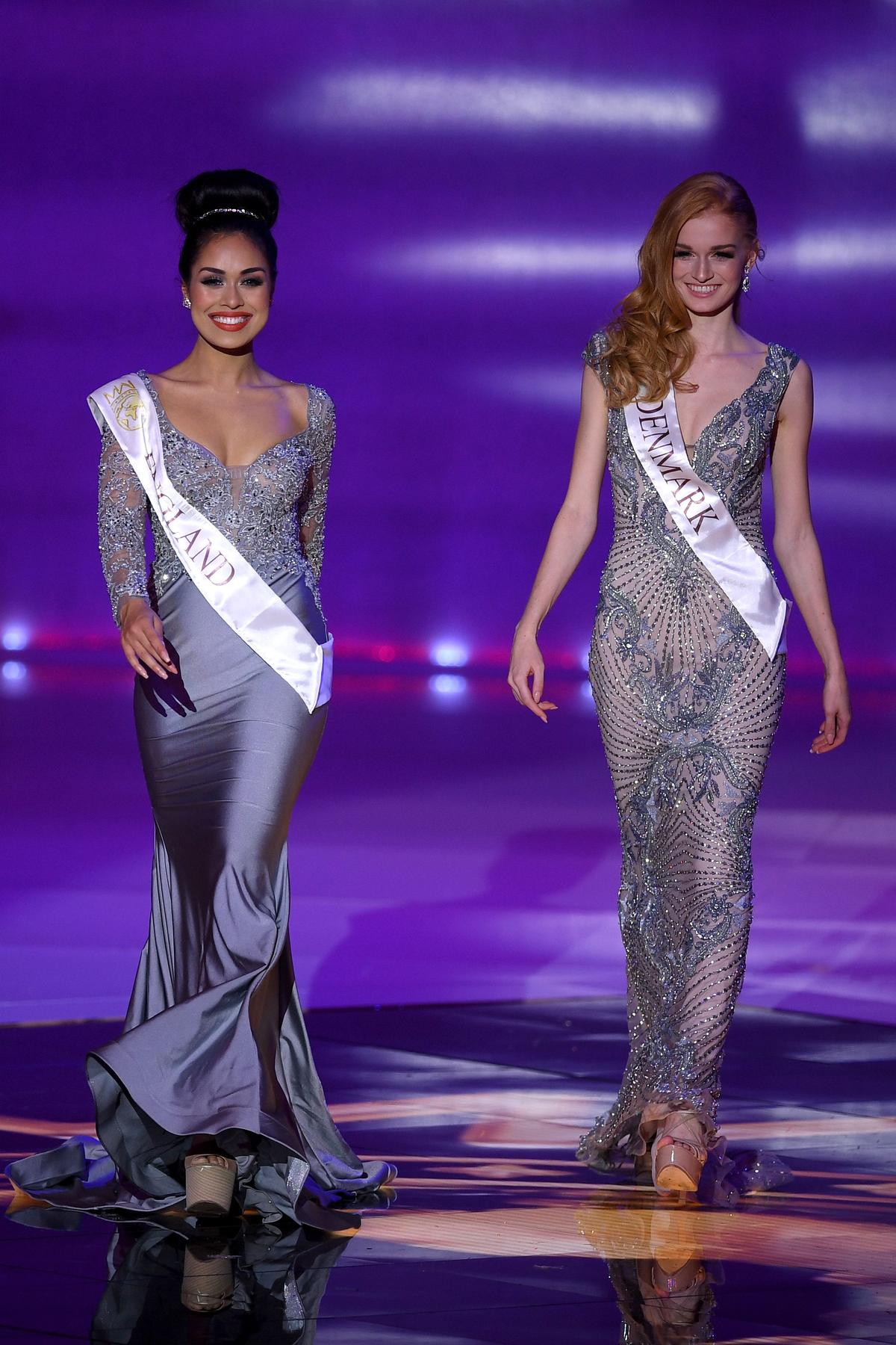 Miss England, Bhasha Mukherjee (L), and Miss Denmark, Natasja Kunde, during the Miss World Finals at the Excel arena in east London, England, on Dec. 14, 2019. (DANIEL LEAL-OLIVAS/AFP via Getty Images)