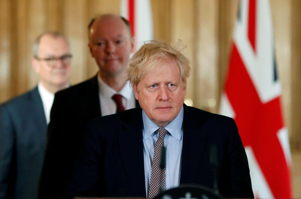 UK Prime Minister Boris Johnson, Chris Whitty, Chief Medical Officer for England and Chief Scientific Adviser to the Government, Sir Patrick Vallance, arrive for a news conference on the CCP virus, in London, UK, on March 3, 2020. (Frank Augstein/Pool via Reuters)