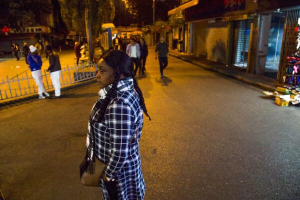 A woman walks near New Don Franc Hotel, part of an ethnically diverse quarter of Guangzhou known as Little Africa in Guangzhou, China, on February 3, 2019. (Betsy Joles/Getty Images)