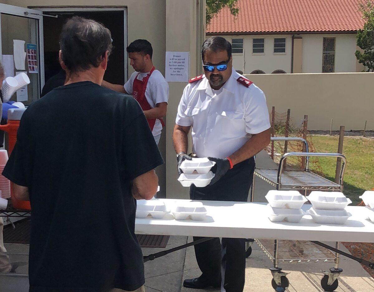Salvation Army Maj. Juan Guadalupe passing out food in Bradenton, Fla. (Melissa Fernandez/Salvation Army)