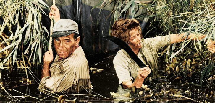 The actors really experience the travails of Africa: swamps, heat, humidity, insects, and rapids. (United Artists)