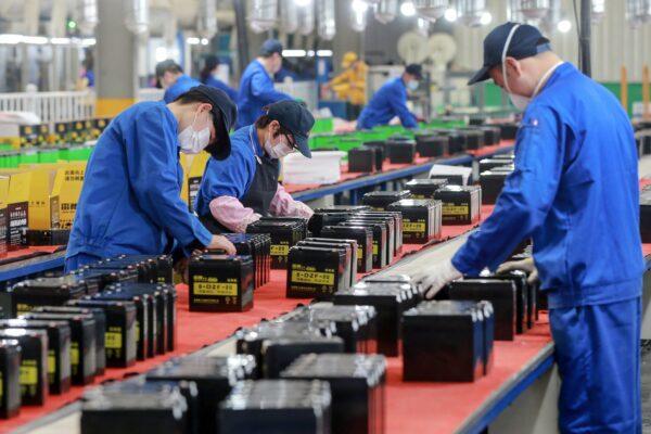 Employees working on a battery production line at a factory in Huaibei in China's eastern Anhui province, on March 30, 2020. (STR /AFP via Getty Images)