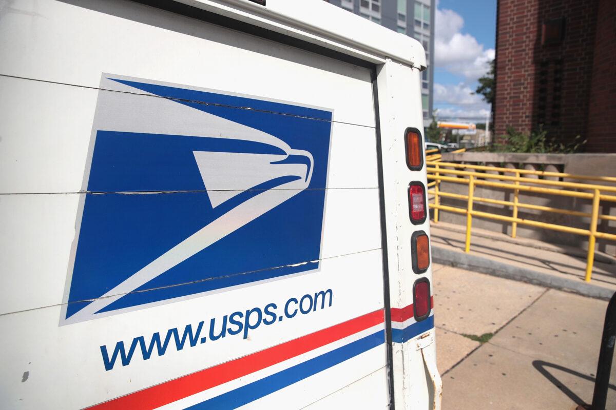 A U.S. Postal Service (USPS) truck leaves a postal facility in Chicago, Ill., on Aug. 15, 2019. (Scott Olson/Getty Images)