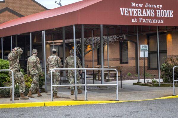 New Jersey Army National Guard combat medics enter the New Jersey Veterans Home at Paramus, N.J., on April 9, 2020. (New Jersey National Guard/Mark C. Olsen)