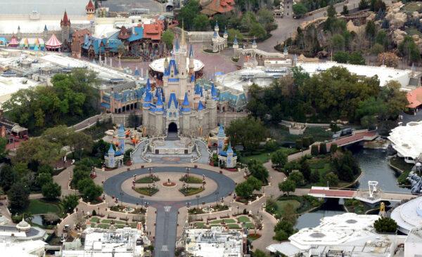Cinderella Castle is seen at the end of an empty Main Street at Disney World's Magic Kingdom theme park after it closed in an effort to combat the spread of COVID-19, in an aerial view in Orlando, Fla., on March 16, 2020. (Gregg Newton/Reuters)