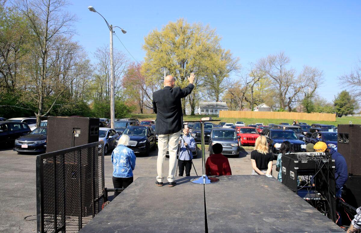 Pastor Chuck Salvo delivers his sermon to the congregation during a drive-in service at On Fire Christian Church in Louisville, Ky., on April 5, 2020. (Andy Lyons/Getty Images)