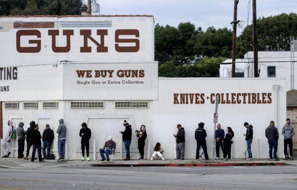 People wait in line to enter a gun store in Culver City, Calif., on March 15, 2020. (Ringo H.W. Chiu/AP Photo)