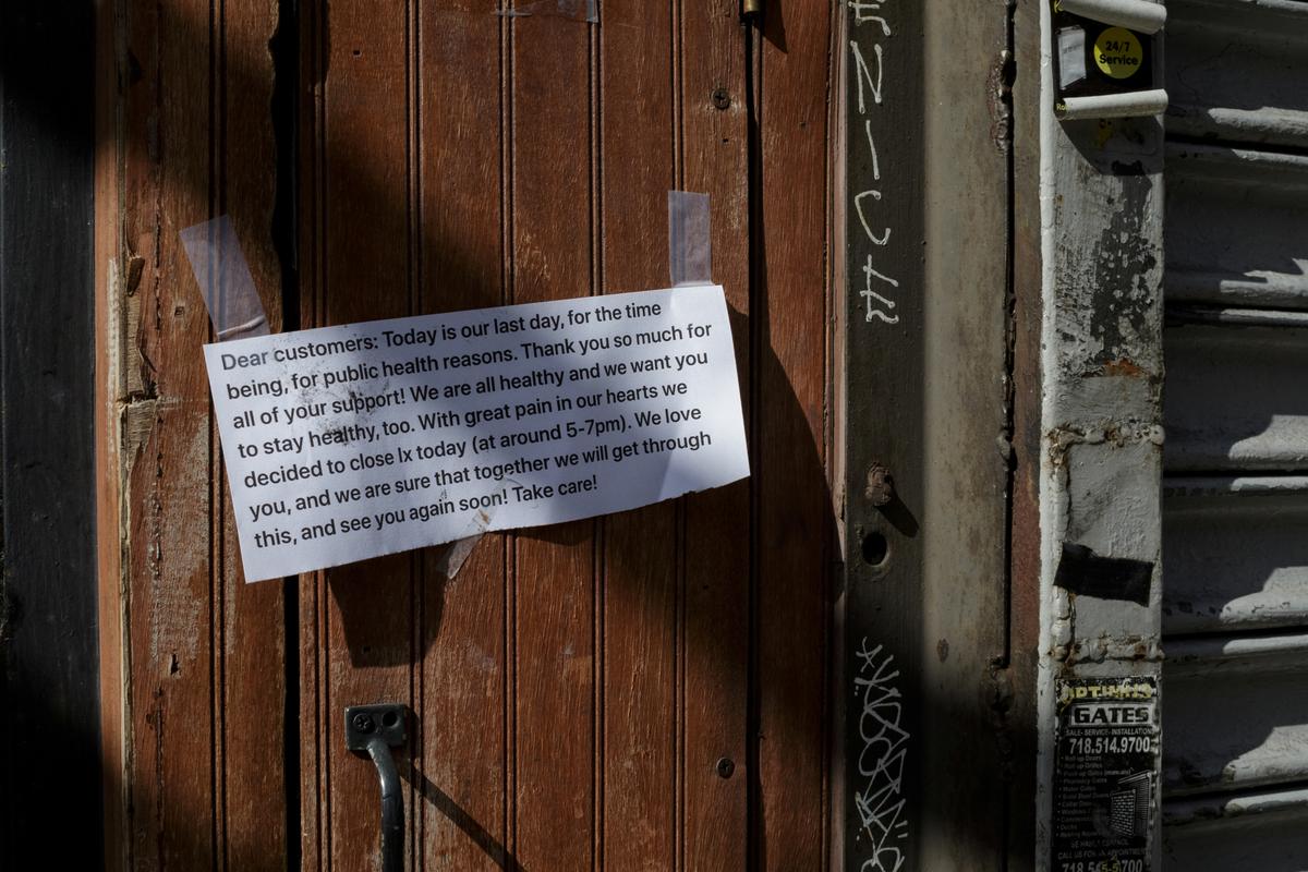 Printed signs are taped to the outside of Ix restaurant announcing its closure, in the Brooklyn borough of New York City, U.S., on April 2, 2020. (Anna Watts/Reuters)