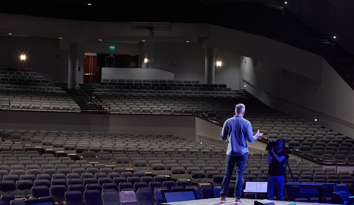 Pastor Jim Erickson delivers a sermon streamed to online viewers, standing in front of empty pews in Eden Prairie, Minnesota, on March 15, 2020. (Adam Bettcher/Getty Images)