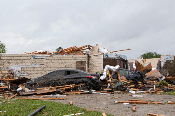 A home had its roof torn off after a tornado ripped through Monroe, La. just before noon on April 12, 2020. (Nicolas Galindo/The News-Star via AP)