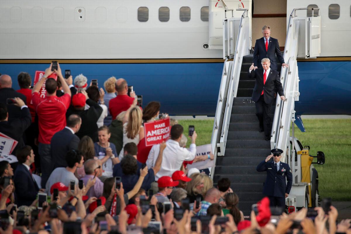 Trailed by Fred Keller, a Republican candidate for Congress in Pennsylvania's 12th Congressional district, President Donald Trump gives the thumbs up as they exit Air Force One and arrive for a campaign rally in Montoursville, Pa., on May 20, 2019. (Drew Angerer/Getty Images)