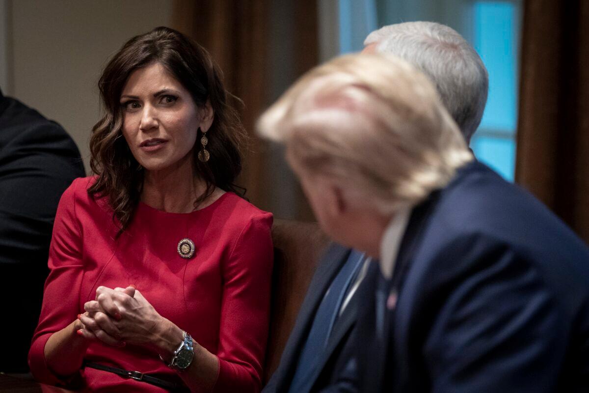 Governor of South Dakota Kristi Noem speaks as President Donald Trump listens during a meeting about the Governors Initiative on Regulatory Innovation in the Cabinet Room of the White House on in Washington on Dec. 16, 2019. (Drew Angerer/Getty Images)