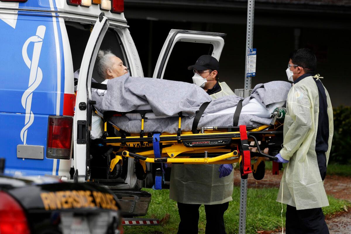 A patient is evacuated from the Magnolia Rehabilitation and Nursing Center in Riverside, Calif., on April 8, 2020. (Chris Carlson/AP)