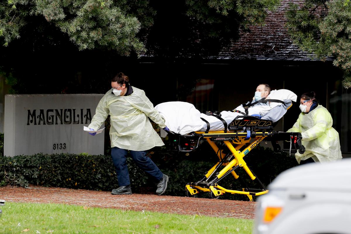 A patient is evacuated from the Magnolia Rehabilitation and Nursing Center in Riverside, Calif., on April 8, 2020. (Chris Carlson/AP)