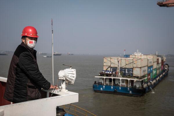 A captain wear a mask in ship at Yangluo container port on the Yangtze River in Wuhan, Hubei province, on April 12, 2020. (Getty Images)