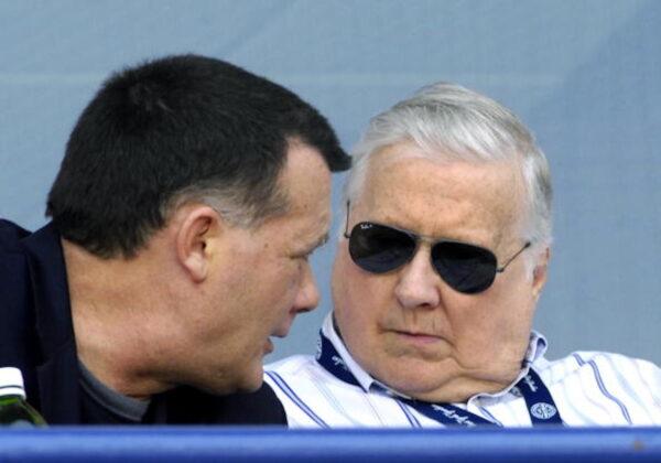 Owner George Steinbrenner of the New York Yankees talks with his son, Hank, against the Philadelphia Phillies at George Steinbrenner Field in Tampa, Fla., on April 1, 2009. (Al Messerschmidt/Getty Images)