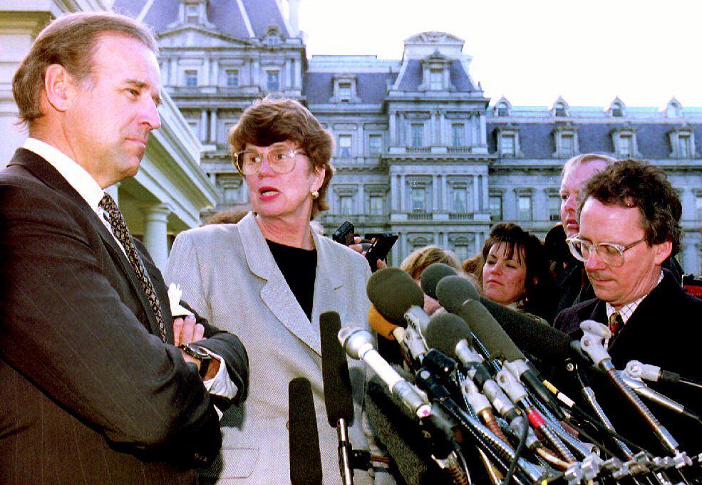 Then Sen. Joe Biden, left, speaks to reporters on March 12, 1993. (J. David Ake/AFP via Getty Images)