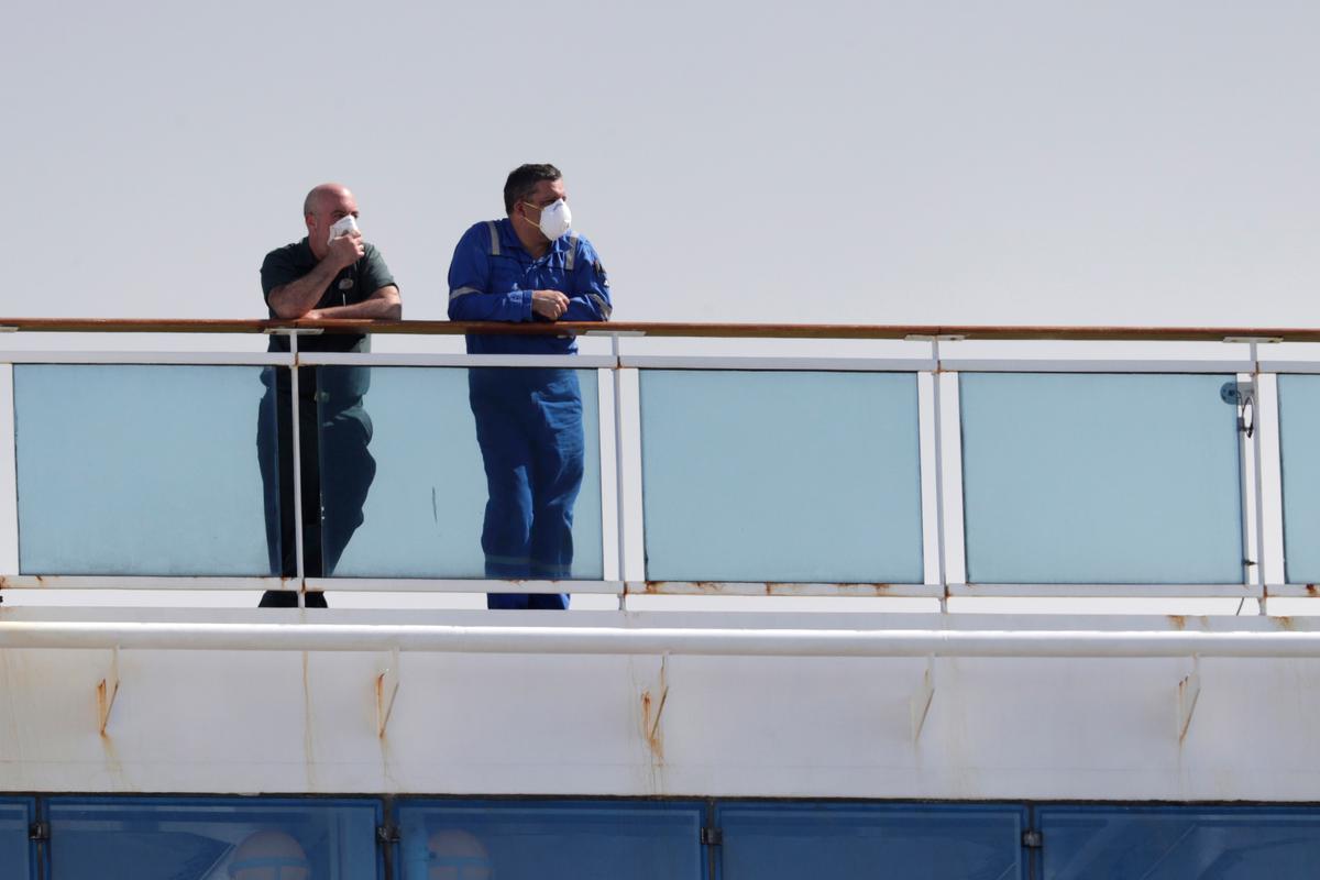 People look out from the Coral Princess cruise ship as it is docked at PortMiami during the new coronavirus outbreak in Miami, on April 4, 2020. (Lynne Sladky/AP Photo)