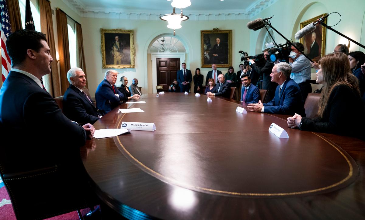 President Donald Trump and Vice President Mike Pence meet with recovered COVID-19 patients in the Cabinet Room at the White House in Washington on April 14, 2020. (Doug Mills-Pool/Getty Images)