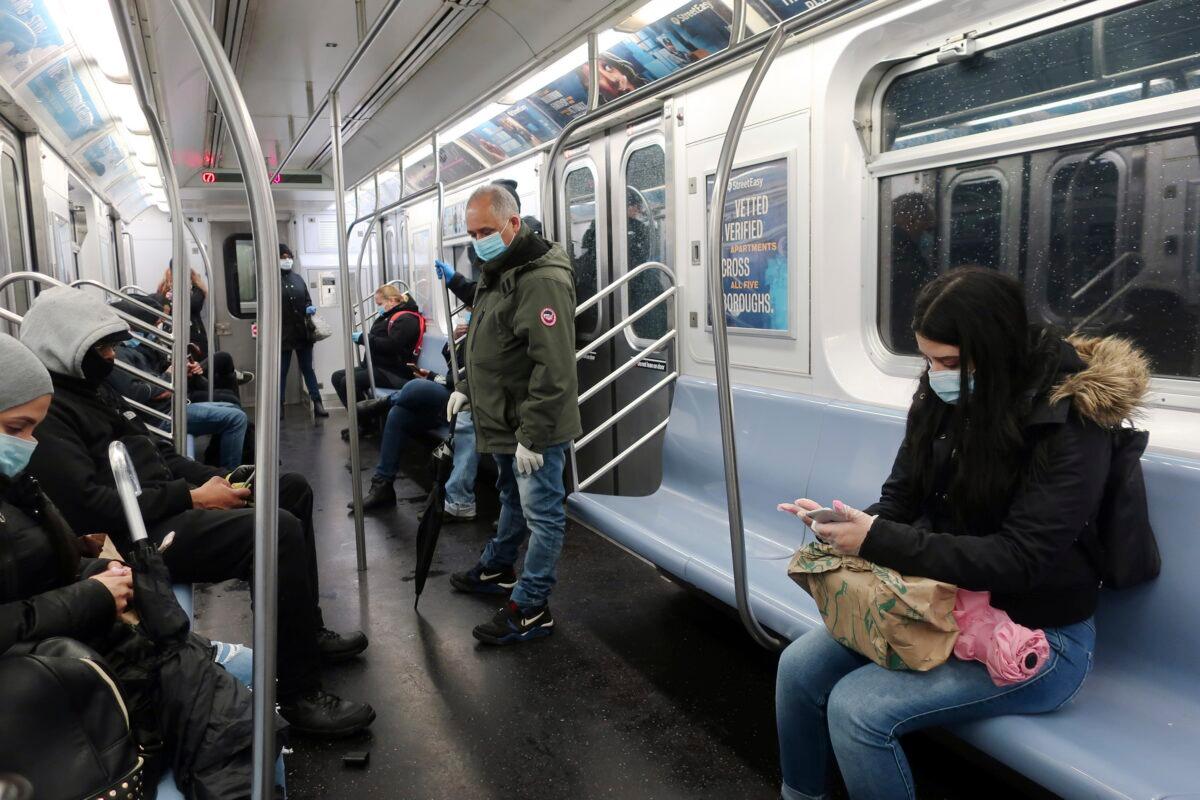 People ride the subway in New York City on April 13, 2020. (Ted Shaffrey/AP Photo)