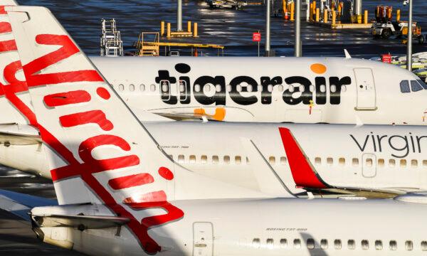 Tiger Air and Virgin sit idle on the tarmac at Melbourne’s Tullamarine Airport on April 12, 2020. (William West/AFP via Getty Images)
