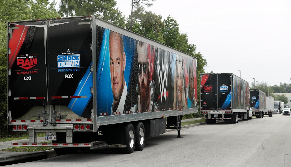 Equipment trailers are lined up at the entrance road to the WWE Performance Center in Orlando, Florida on April 14, 2020. (John Raoux/AP Photo)
