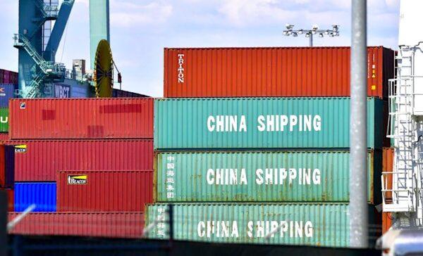 Containers originating from China are stacked on a vessel at a port in California in a file photo. (Frederic J. Brown/AFP/Getty Images)
