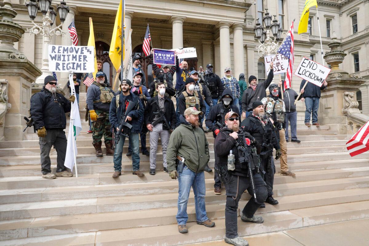 People take part in a protest for "Michiganders Against Excessive Quarantine" at the Michigan State Capitol in Lansing, Mich., on April 15, 2020. (Jeff Kowalsky/AFP via Getty Images)
