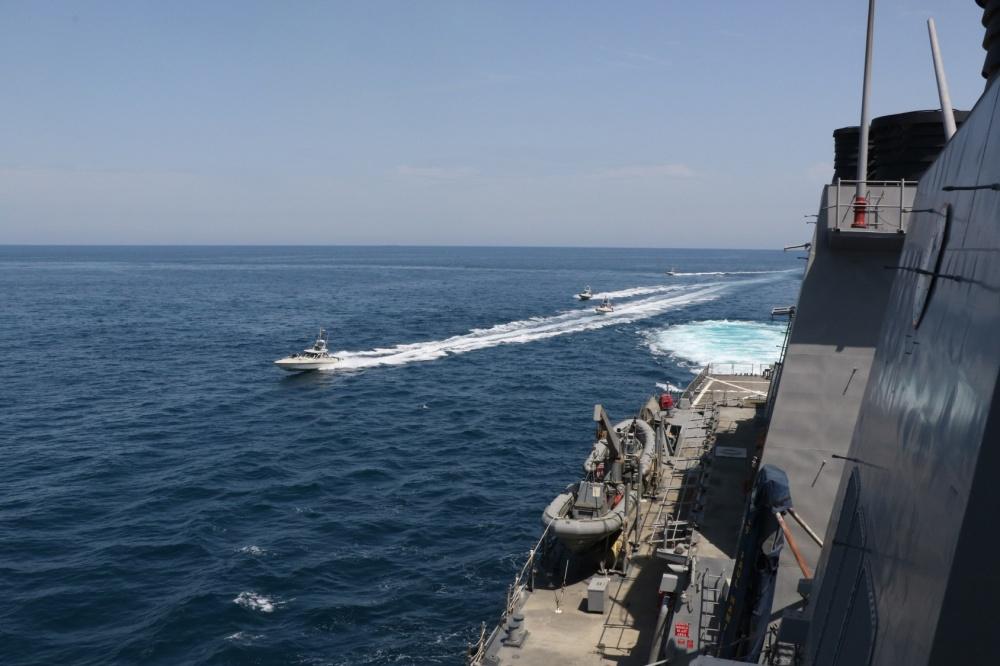 Iranian Islamic Revolutionary Guard Corps Navy (IRGCN) vessels conducted unsafe and unprofessional actions against U.S. military ships by crossing the ships’ bows and sterns at close range while operating in international waters of the North Arabian Gulf. The guided-missile destroyer USS Paul Hamilton (DDG 60) is conducting joint interoperability operations in support of maritime security in the U.S. 5th Fleet area of operations on April 15, 2020. (U.S. Navy photo)