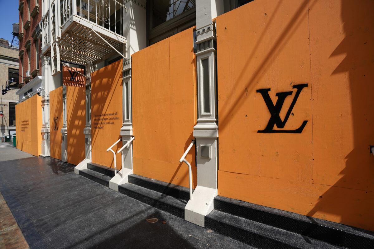 A closed Louis Vuitton in Soho is covered in plywood in New York City on April 15, 2020. (Bryan R Smith/Reuters)