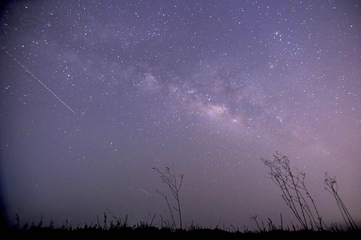 Long-exposure photograph showing the Lyrid meteor shower passing near the Milky Way in the clear night sky near Yangon, Myanmar. (Ye Aung Thu/AFP via Getty Images)