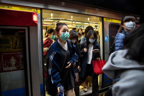Commuters pack a metro train in downtown Taipei, Taiwan on March 16, 2020. (Paula Bronstein/Getty Images)