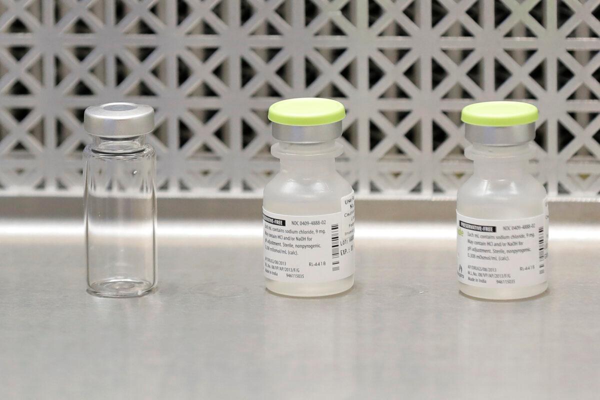 Vials used by pharmacists to prepare syringes used on the first day of a first-stage safety study clinical trial of the potential vaccine for the CCP virus, at the Kaiser Permanente Washington Health Research Institute in Seattle on March 16, 2020. (Ted S. Warren/AP Photo)