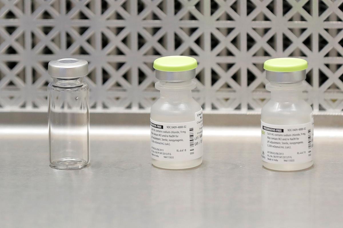 Vials on the first day of a first-stage safety study clinical trial of the potential vaccine for the CCP virus at the Kaiser Permanente Washington Health Research Institute in Seattle, Washington state, on March 16, 2020. (Ted S. Warren/AP Photo)