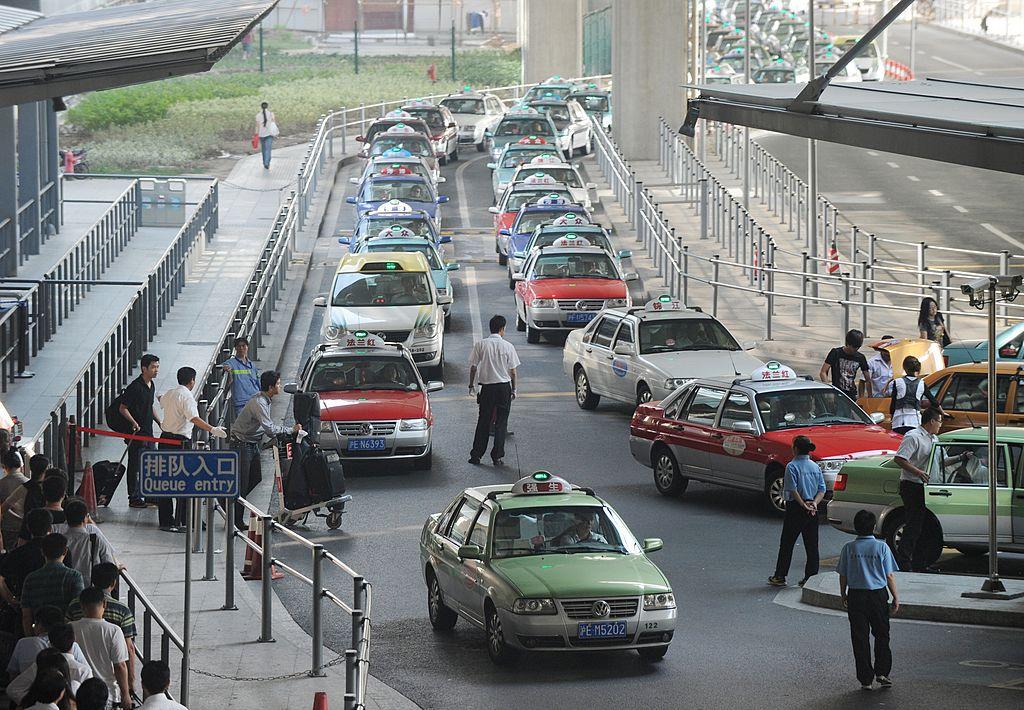 Taxi drivers wait for customers at the Hongqiao Airport in Shanghai. (MARK RALSTON/AFP via Getty Images)