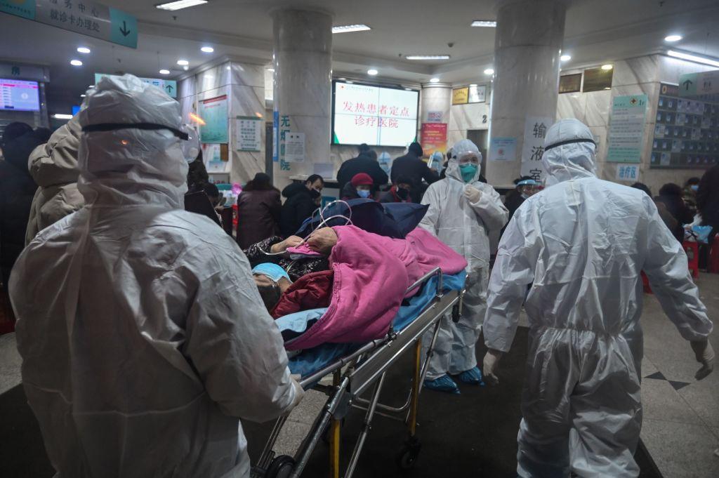 Medical staff wear protective clothing to protect against a CCP virus patient at the Wuhan Red Cross Hospital in Wuhan, China, on Jan. 25, 2020. (Hector Retamal/AFP via Getty Images)