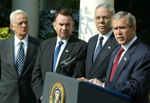 U.S. President George W. Bush (R), U.S. Secretary of Treasury Paul O'Neill (L), U.S. Secretary of Health and Human Services Tommy Thompson (2nd-L), and U.S. Secretary of State Colin Powell (2nd-R) in the Rose Garden at the White House in Washington on June 19, 2002. (Mark Wilson/Getty Images)