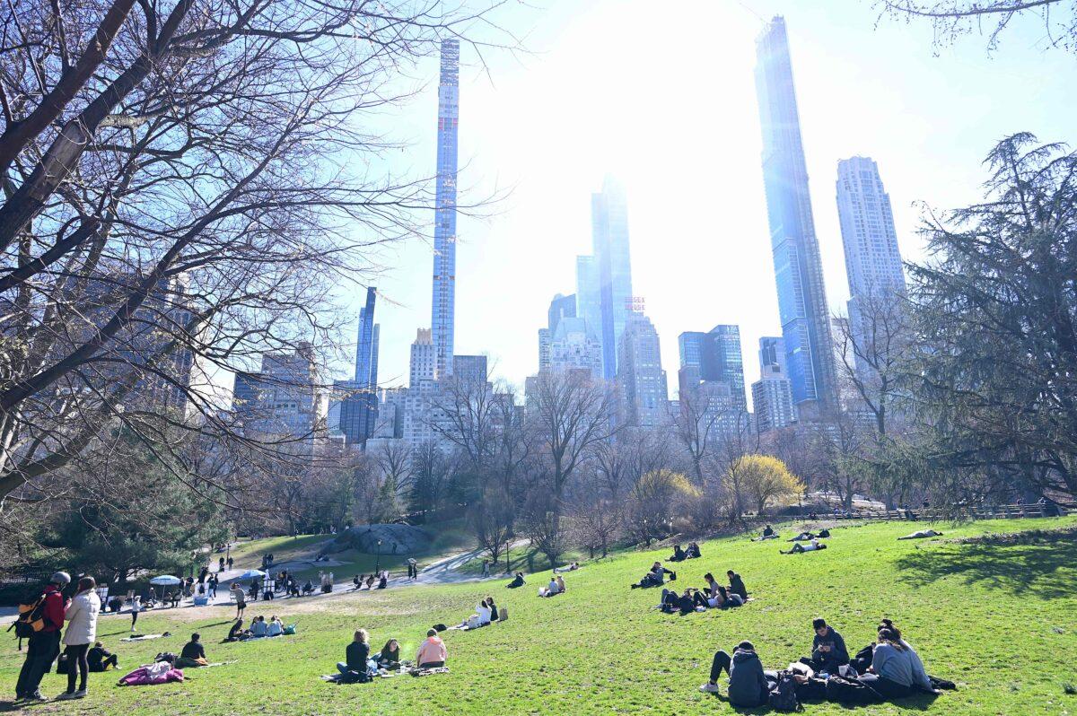 People enjoy the sun in Central Park in New York City on March 14, 2020. (Johannes Eisele/AFP via Getty Images)