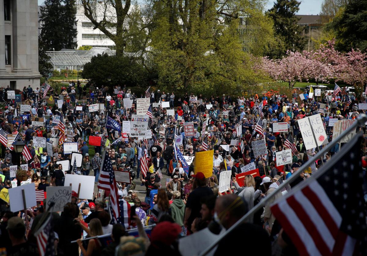 Protesters rally against an extended stay-at-home order at the Capitol building in Olympia, Wash., on April 19, 2020. (Reuters/Lindsey Wasson)