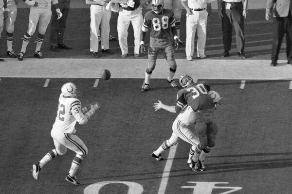 Baltimore Colts linebacker Mike Curtis reaches for the ball to make an interception of a Dallas pass intended for Dan Reeves (30) in the fourth period of the Super Bowl football game in Miami on Jan. 17, 1971. (AP Photo)
