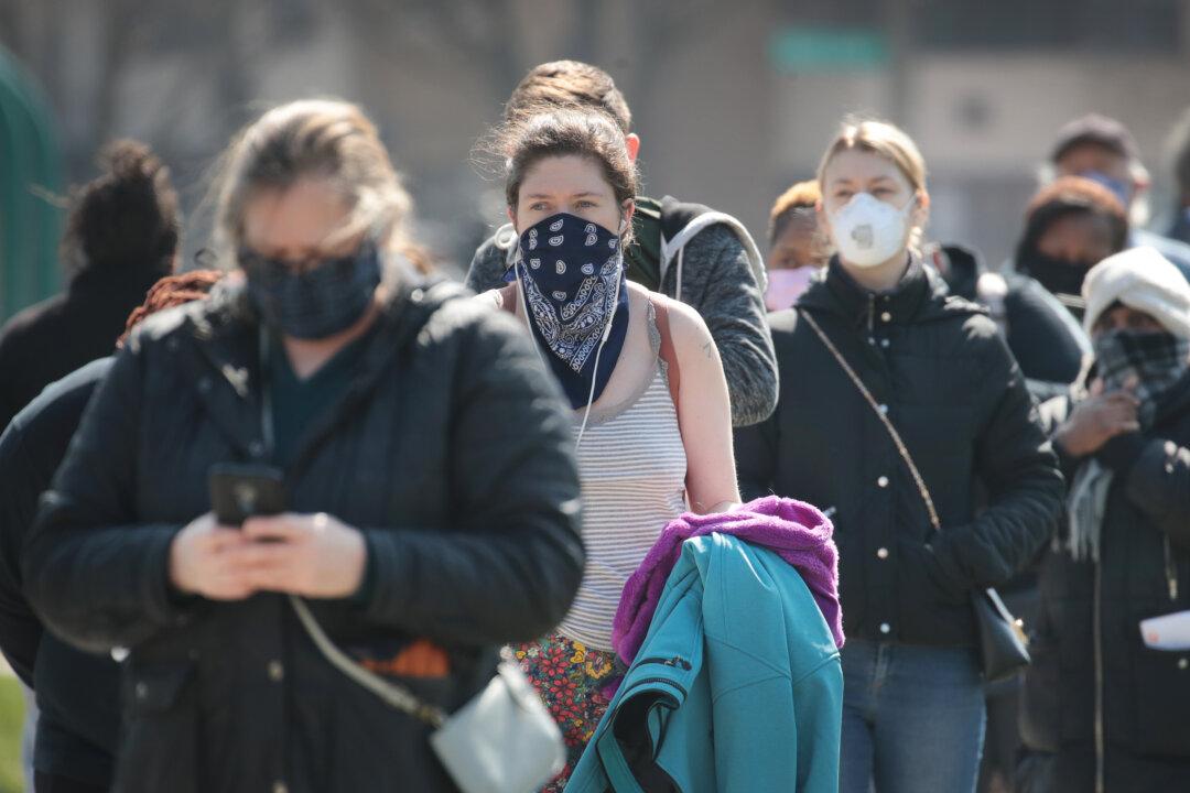 Officials: 7 Virus Cases Appear Related to In-Person Voting