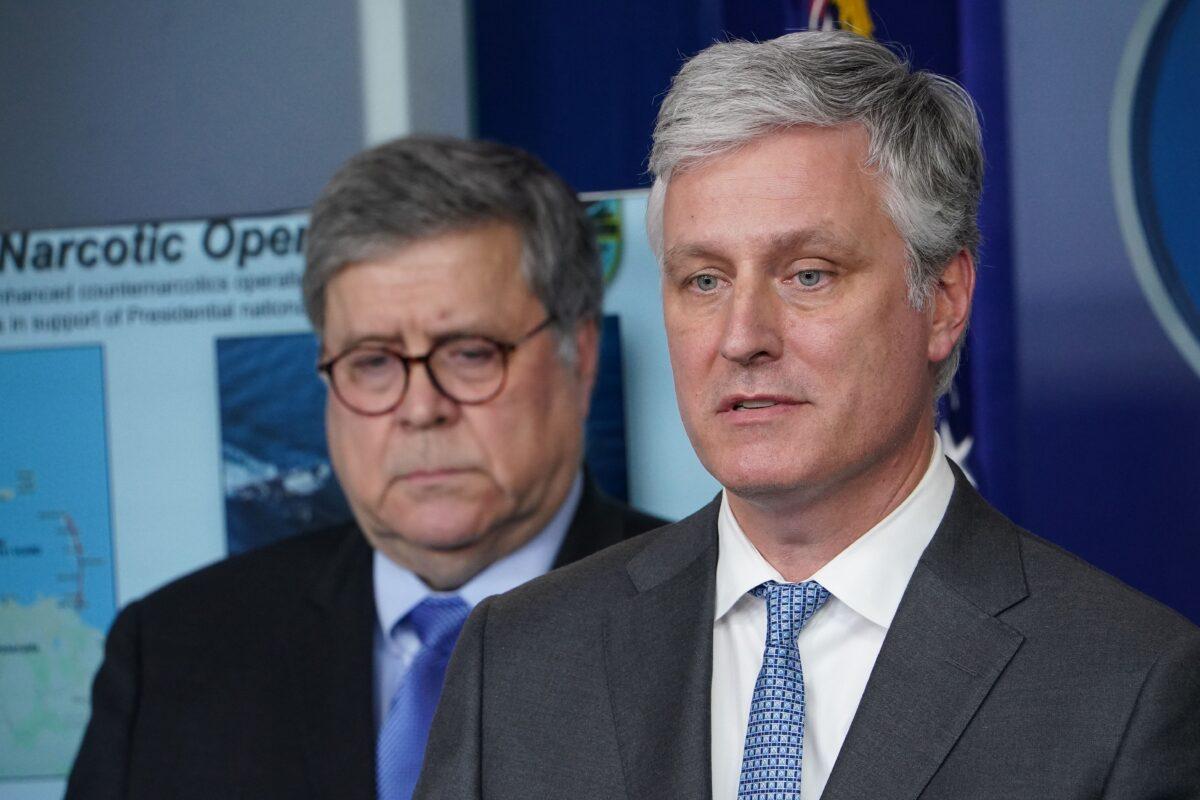 National security adviser Robert O'Brien, right, speaks while Attorney General William Barr listens during the daily briefing on the CCP virus in the Brady Briefing Room at the White House in Washington on April 1, 2020. (Mandel Ngan/AFP via Getty Images)