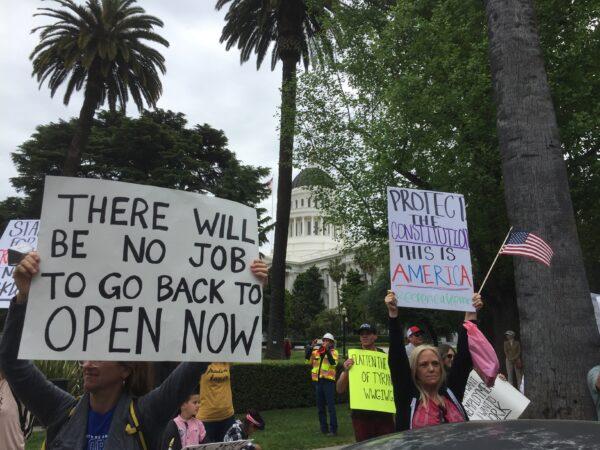 People gather around the California State Capitol in Sacramento on April 20, 2020, to protest against the statewide lockdown. (Laurie Gorham/The Epoch Times)